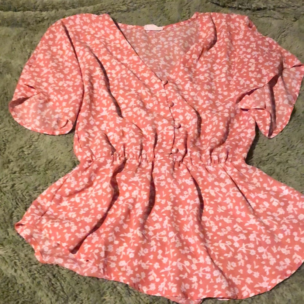 Pink and White floral shirt.